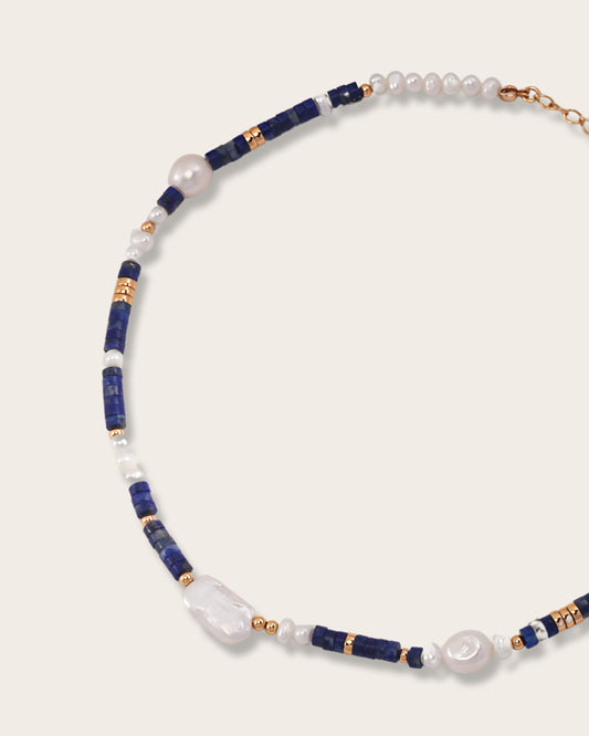The "Ocean's Treasure Necklace" symbolizes the profound beauty, mystery, and hidden depths of the ocean, serving as a reminder to embrace life's enigmas and discover the treasures within.  Handcrafted with love, this timeless piece adds a touch of elegance to any outfit. Perfect for a romantic dinner or a casual day out.
