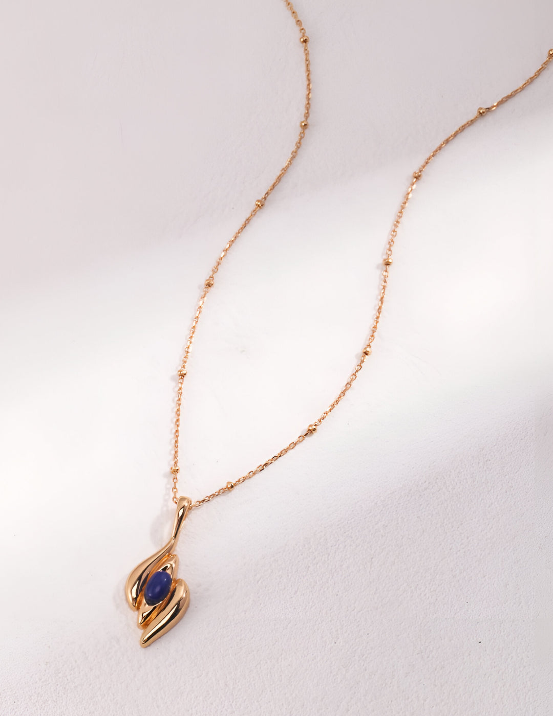 Capturing the essence of artistic beauty - Expressive Earrings - S925 Sterling Silver with 18K Gold Vermeil - Embed with natural blue gemstone - Crafted to add a touch of enchantment and allure to your everyday look