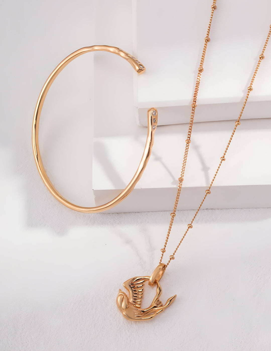 A captivating masterpiece inspired by the Mythical Bird - S925 Sterling Silver with 18K Gold Vermeil - Radiate elegance and embrace your inner strength