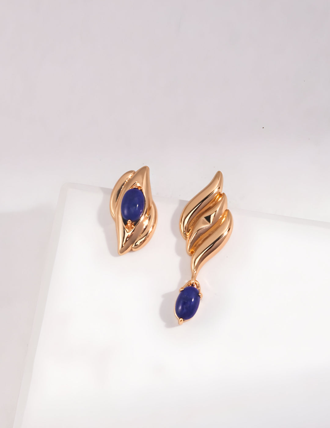 Capturing the essence of artistic beauty - Expressive Earrings - S925 Sterling Silver with 18K Gold Vermeil- Embed with natural blue gemstone - Crafted to add a touch of enchantment and allure to your everyday look