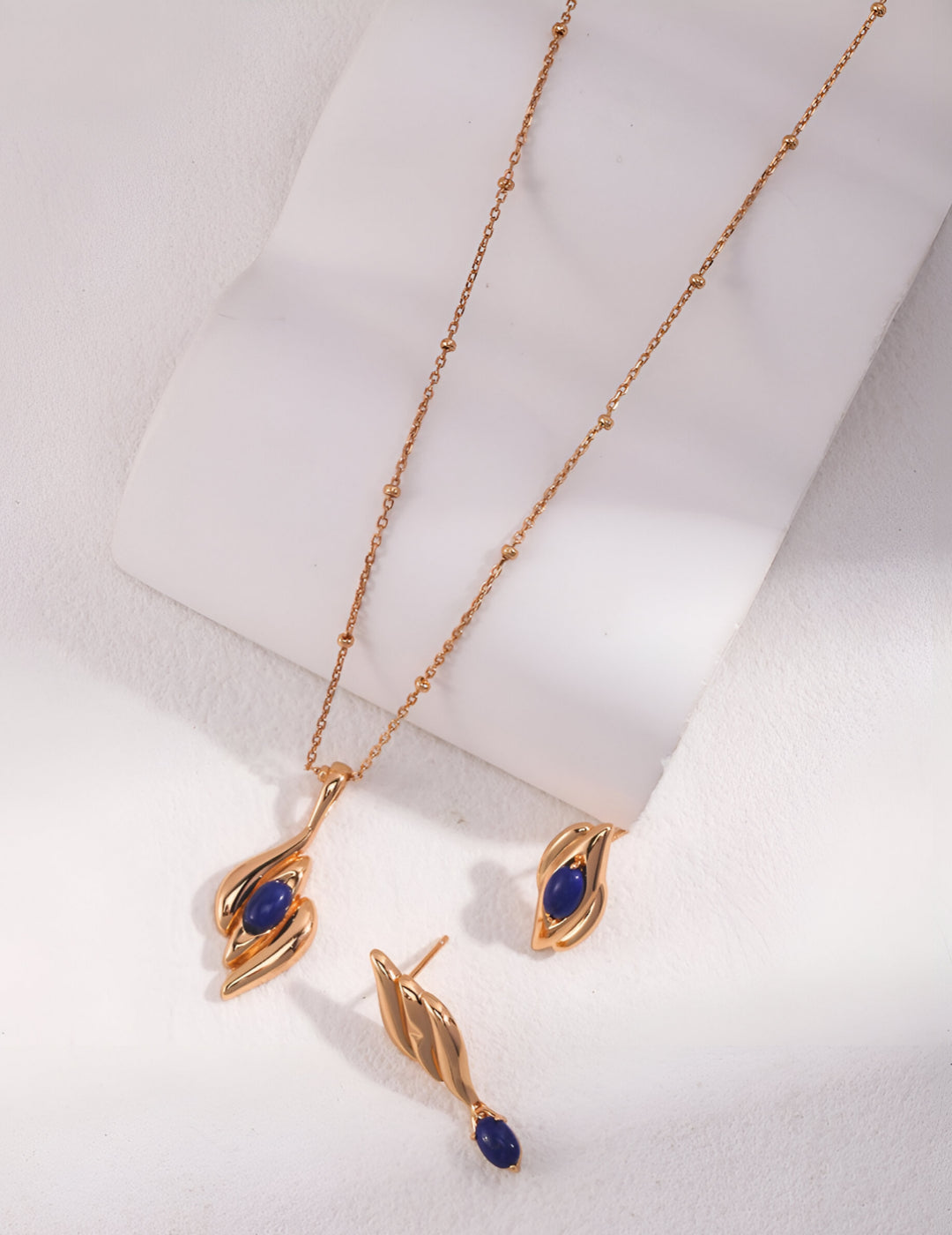 Capturing the essence of artistic beauty - Expressive Earrings - S925 Sterling Silver with 18K Gold Vermeil - Embed with natural blue gemstone - Crafted to add a touch of enchantment and allure to your everyday look